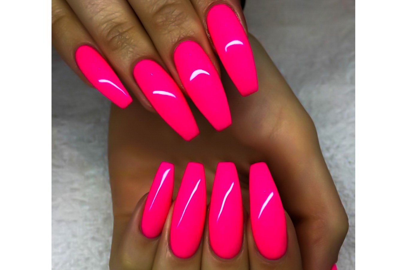 neon pink nails.